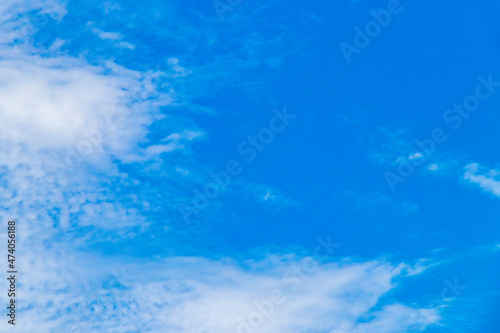 Blue sky with chemical clouds chemical sky chemtrails sunny day.