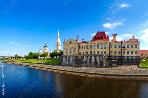 Rybinsk, Russia. Waterfront near building of former Grain Exchange or building of Rybinsk State Historical. Transfiguration Cathedral