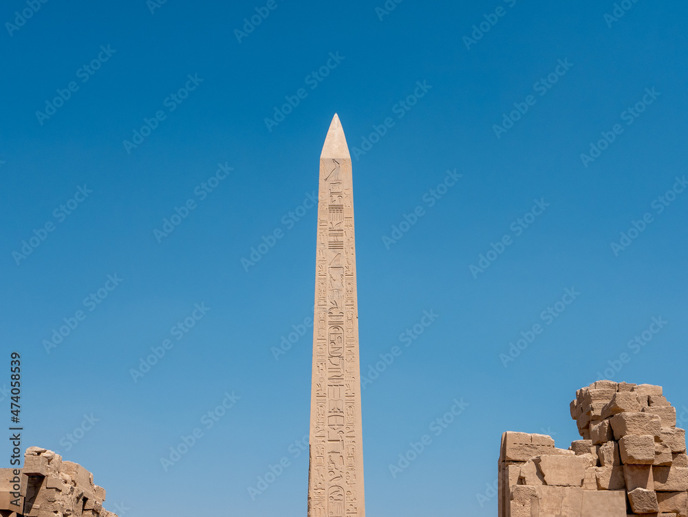 Obelisk at Karnak Temple with Egyptian hieroglyphs and ancient drawings. Luxor, Egypt.
