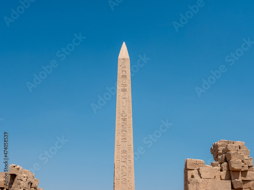 Obelisk at Karnak Temple with Egyptian hieroglyphs and ancient drawings. Luxor, Egypt.