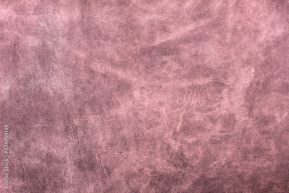 Fototapeta premium Beautiful red background with leather texture with red veins of red leather as sample of red background from natural leather or sample of texture of leather for beautiful natural background
