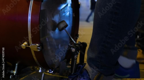 foot of a street musician playing the bass drum