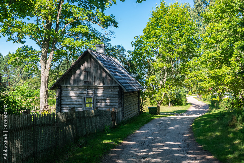 Idyllic wooden historic houses with thatched roof in Altja fishing village, northern Estonia Idyllic wooden historic houses with thatched roof in Altja fishing village, northern Estonia
