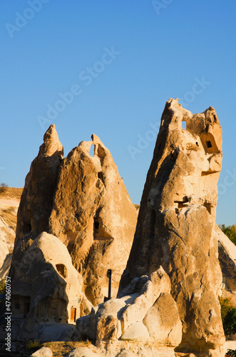 Close-up view ancient cave houses near Goreme in Cappadocia. Amazing shaped sandstone rocks. Popular travel destination in Turkey. UNESCO World Heritage Site