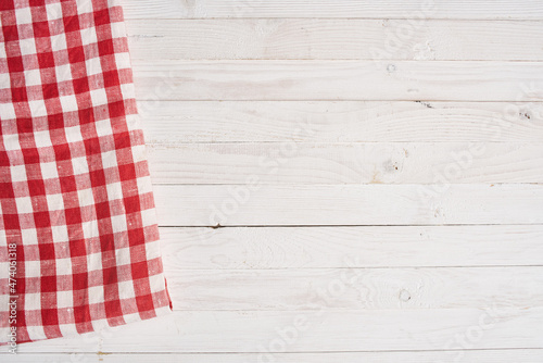 Red checkered tablecloth wooden background texture kitchen decoration