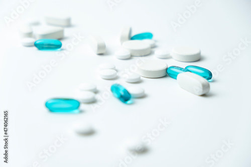 white and blue pills isolated on white background