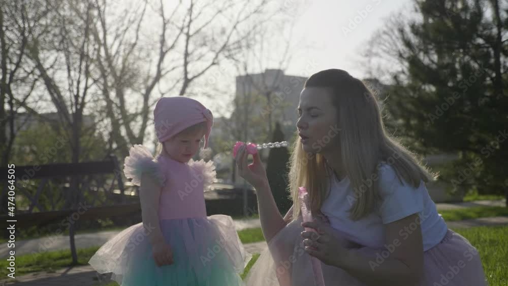 Medium plan mom and daughter in the park