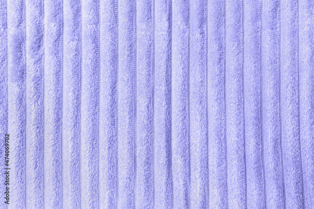 Color of the year 2022 Very Peri. Trendy color concept. Soft pastel fleece throw fabric with lines. Texture for cozy winter background Color of the year 2022 Very Peri. Trendy color concept. Soft pastel fleece throw fabric with lines. Texture for cozy winter background