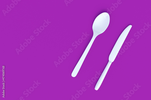 White spoon and knife on violet background. Top view. Copy space. 3d render