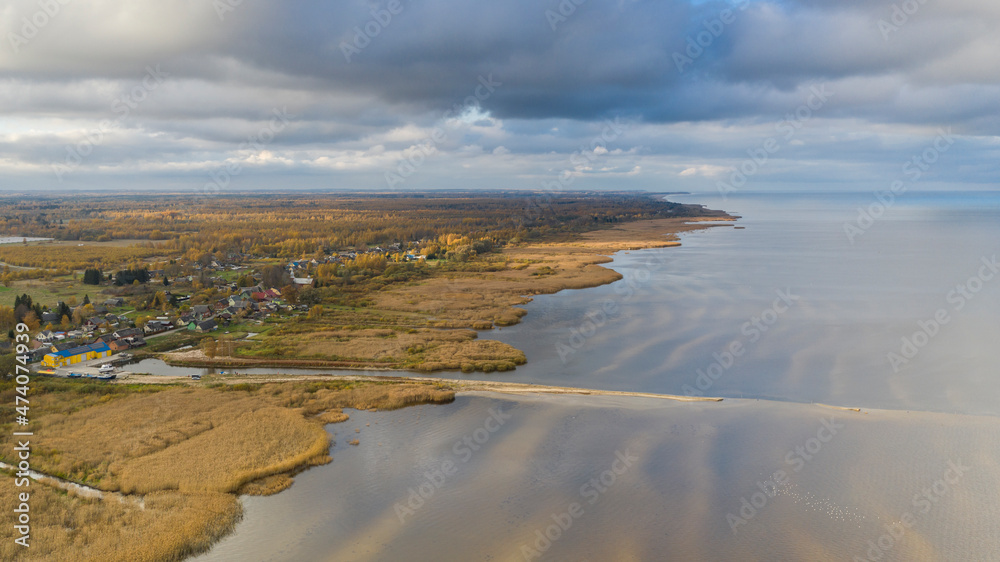 Aerial view to the autumn colored  shallow and sandy  coastal zone of the Lake Peipsi, in Varnja, Estonia. It is the 4th largest lake in Europe