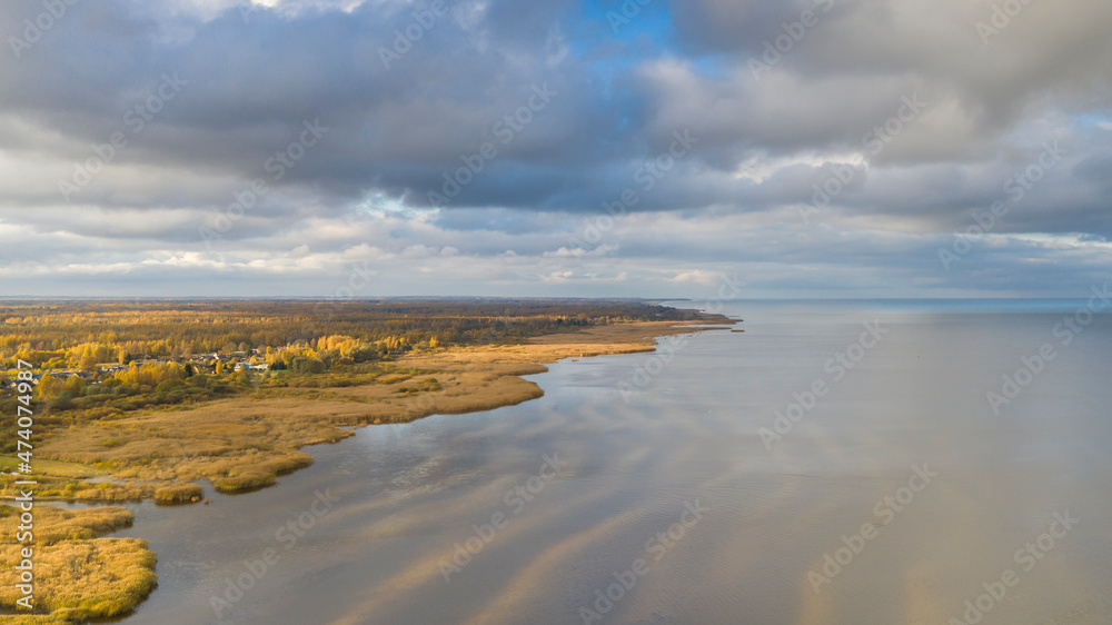 Aerial view to the autumn colored  shallow and sandy  coastal zone of the Lake Peipsi, in Varnja, Estonia. It is the 4th largest lake in Europe