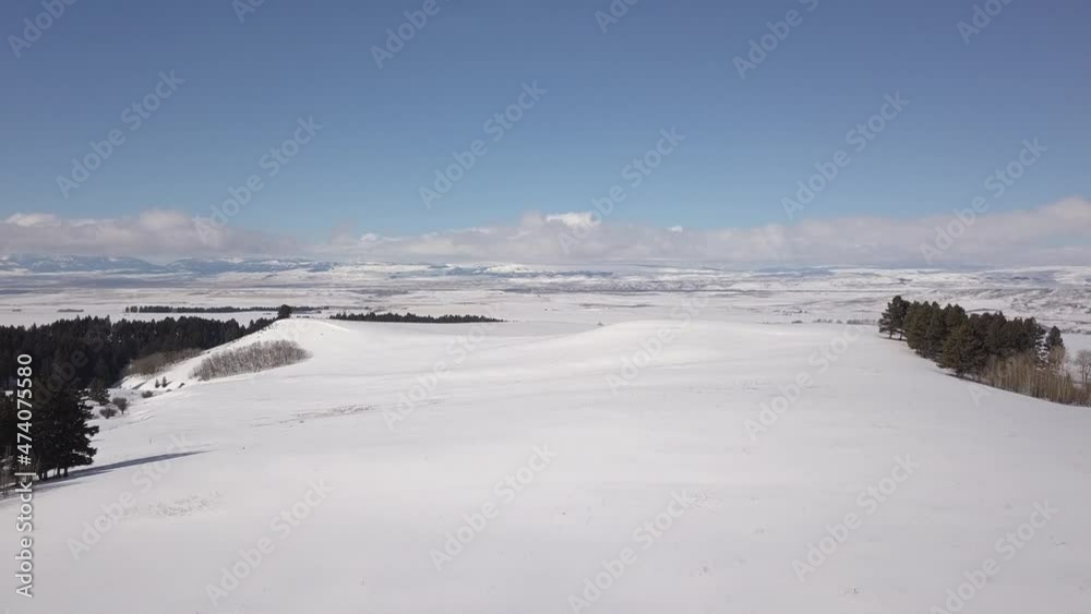 Flying over vast open snow-covered plains Flying over vast open snow-covered plains