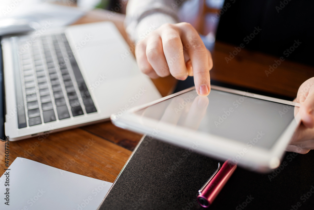 Fototapeta premium Working with documents online. Manager report in the office workplace. Calculates the company's finances for the quarter.