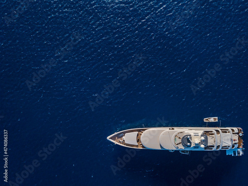 Aerial view on white yacht in blue sea © Anton Tolmachov