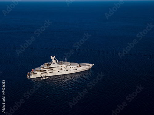 Aerial view on white yacht in blue sea © Anton Tolmachov