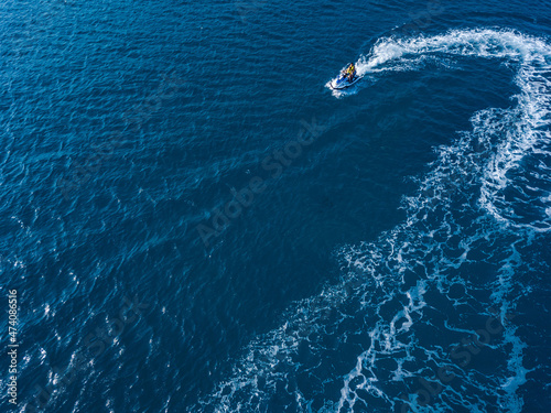 View from drone of jet ski in azure sea. Water sport