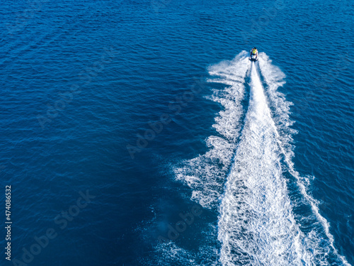 View from drone of jet ski in azure sea. Water sport © Anton Tolmachov