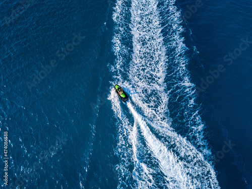 View from drone of jet ski in blue sea. Water sport