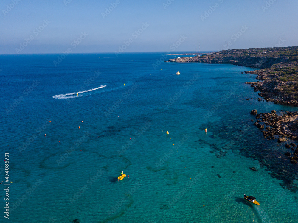Aerial view on jet ski in azure water of a sea