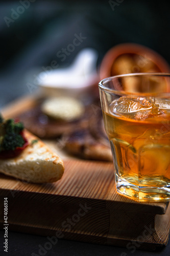 a glass of whiskey on a steak background