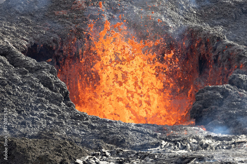volcano caldera in eruption with lava