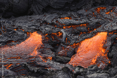 incandescent flowing volcanic lava in volcano
