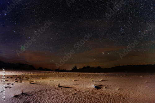 The sandy desert landscape at starry night photo