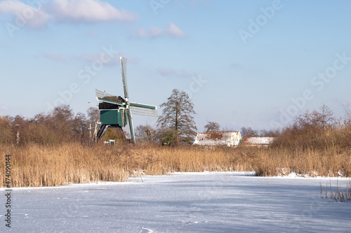 Windmill in the winter polder landscape near Tienhoven in the Netherlands.