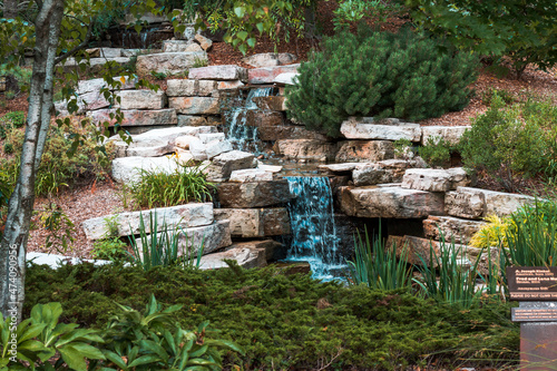 Small waterfall in a garden in a park