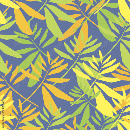 Blue seamless background with yellow and green leaves