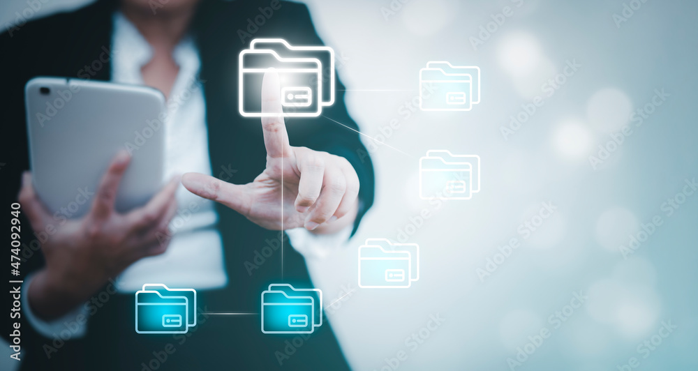 Businesswoman hand touch folder of document Management System, online documentation database and process automation to efficiently manage files work, knowledge, Corporate business technology. Businesswoman hand touch folder of document Management System, online documentation database and process automation to efficiently manage files work, knowledge, Corporate business technology.
