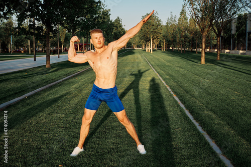 sporty man workout in park crossfit exercise summer