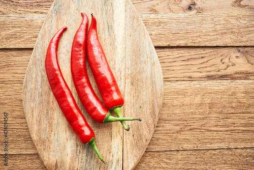 red hot chili peppers on a wooden board kitchen ingredients