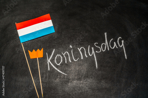 Hyacinths and paper Netherlands on chalkboard background. Koningsdag or Kings Day is a national holiday in the Kingdom of the Netherlands. © Alrandir