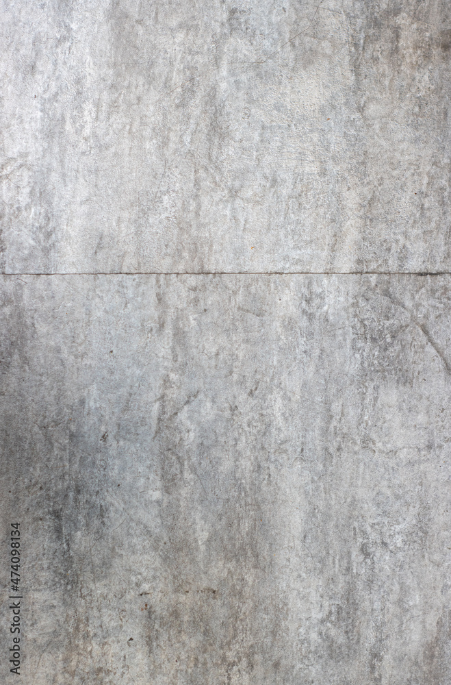 vertical image of the gray texture of a tile