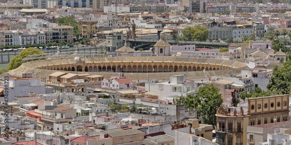 Aerial view on a r the center of the city of Seville , Spain, with the Plaza de toros de la Real Maestranza de Caballería , bullfighting ring