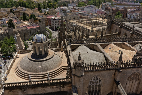 Ornate roofs s of the CCathedral of Saint Mary of the See in ornate gothic style in Seville, Spaiin. 