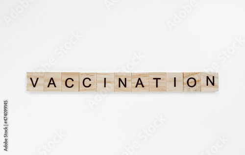Layout with the word vaccination made from wooden letters 