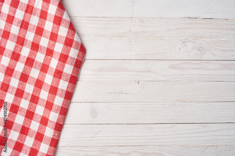 Red checkered tablecloth wooden background texture kitchen decoration Red checkered tablecloth wooden background texture kitchen decoration