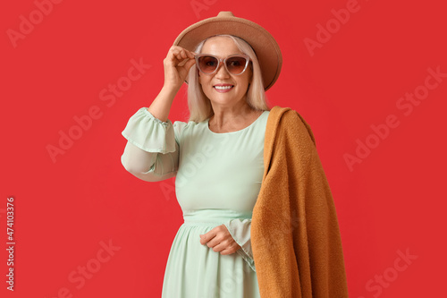 Fashionable mature woman in...