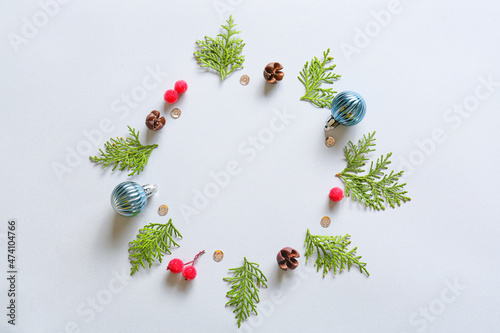 Beautiful wreath made of fir branches and Christmas decor on light background