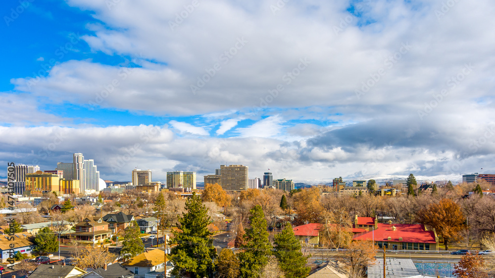 Aerial Panoramic view of the Reno downtown cityscape with hotels, casinos and urban areas against an overcast sky.