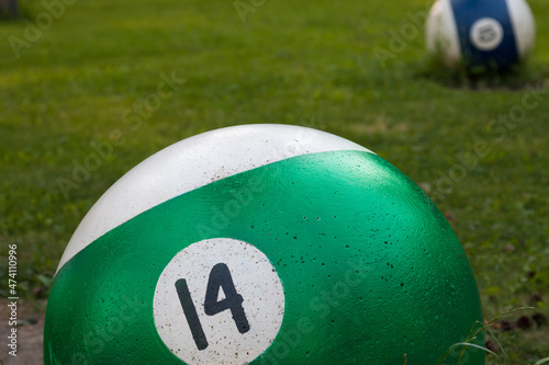Park figure green billiard ball on grass background