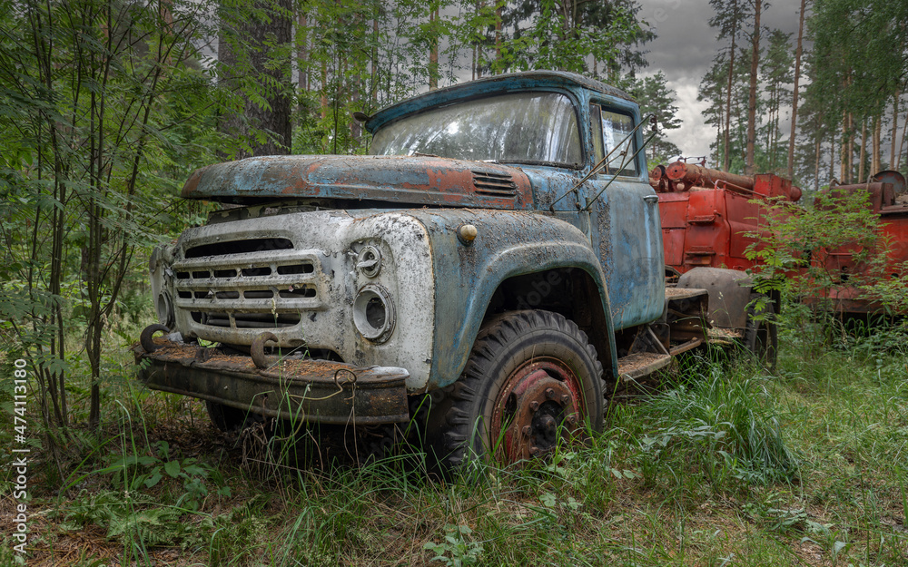 Soviet retro truck rusting in the woods