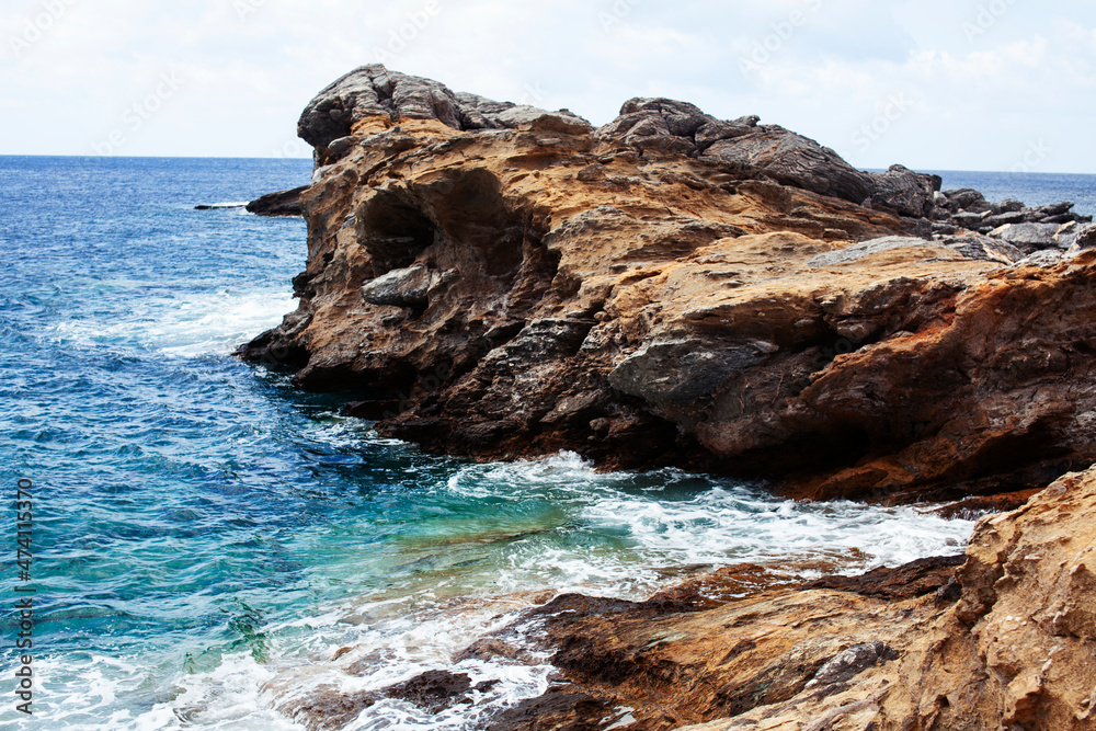 Beautiful wild landscape: seashore with rocks and clear water Beautiful wild landscape: seashore with rocks and clear water