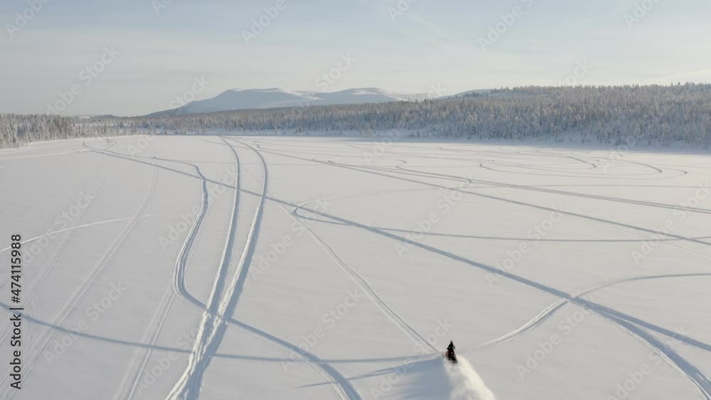 Cinematic drone footage of snowmobile acceleration 4k