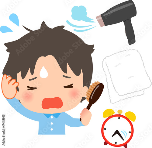 焦って寝ぐせを直すパジャマ姿の男性