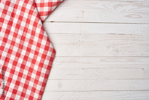 Red checkered tablecloth wooden background texture kitchen decoration photo