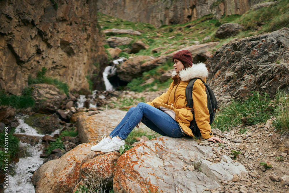 Naklejka premium woman hiker with backpack mountains travel adventure freedom