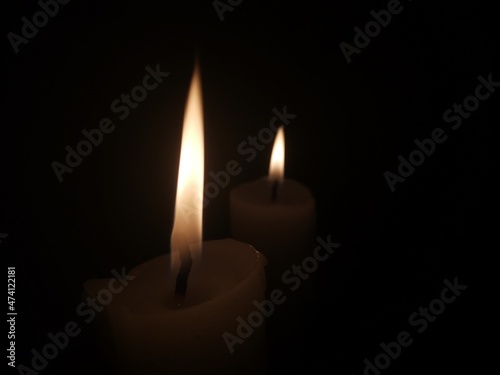 burning candle in the dark
